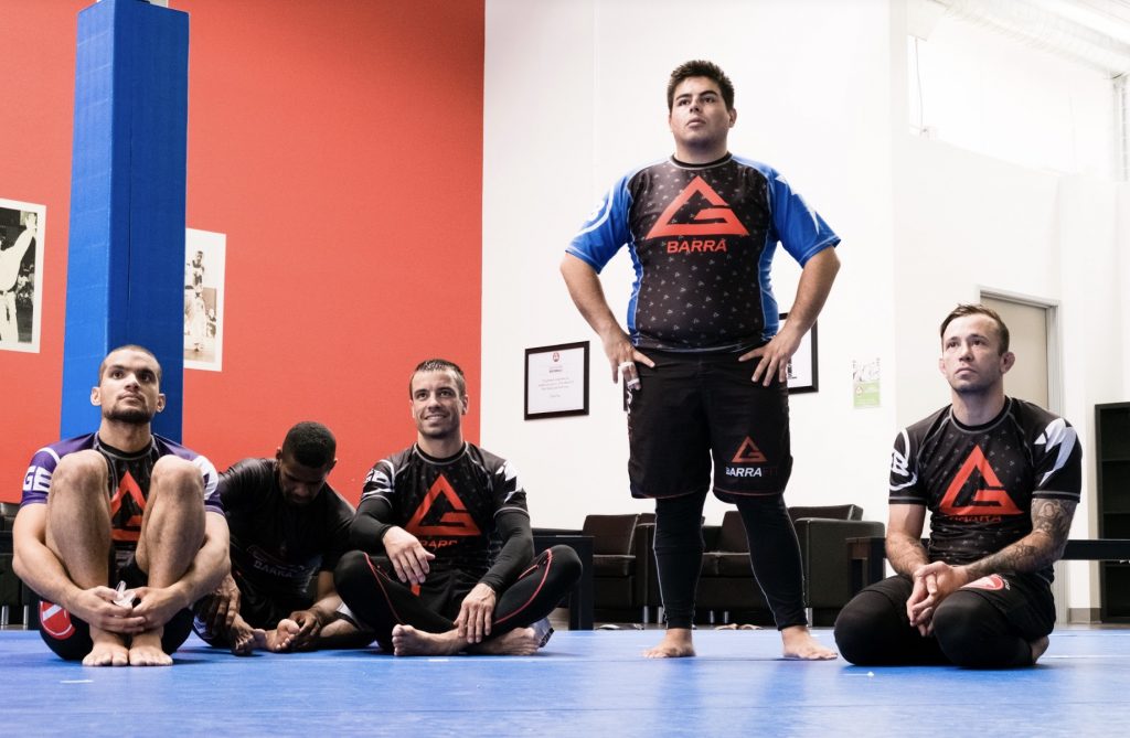 Gracie Barra students sitting on the mat