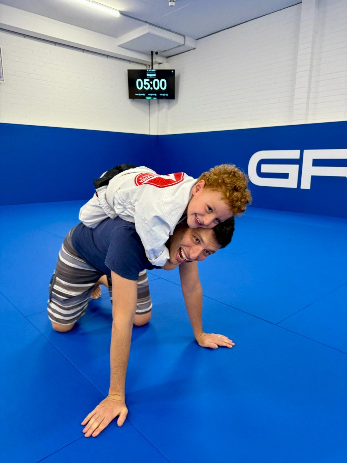 Young child and parent enjoying the 3 and 4 year old BJJ program at Gracie Barra Artarmon