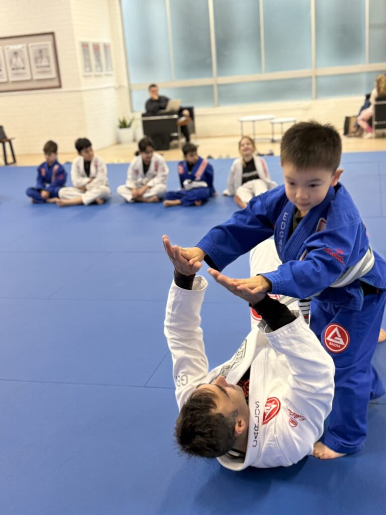 Children participating in a structured Brazilian Jiu-Jitsu after-school class at Gracie Barra Artarmon
