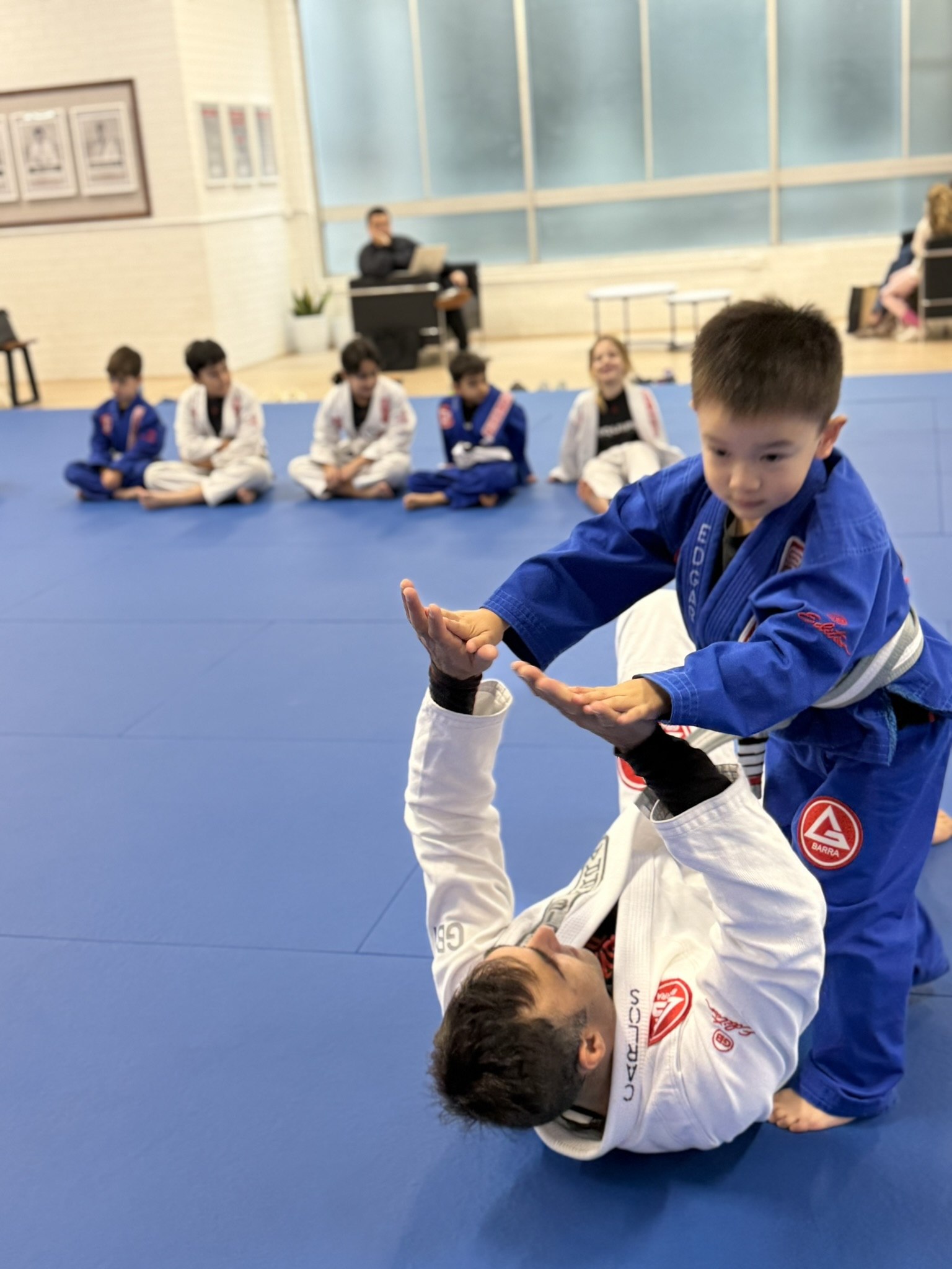 Children participating in a structured Brazilian Jiu-Jitsu after-school class at Gracie Barra Artarmon