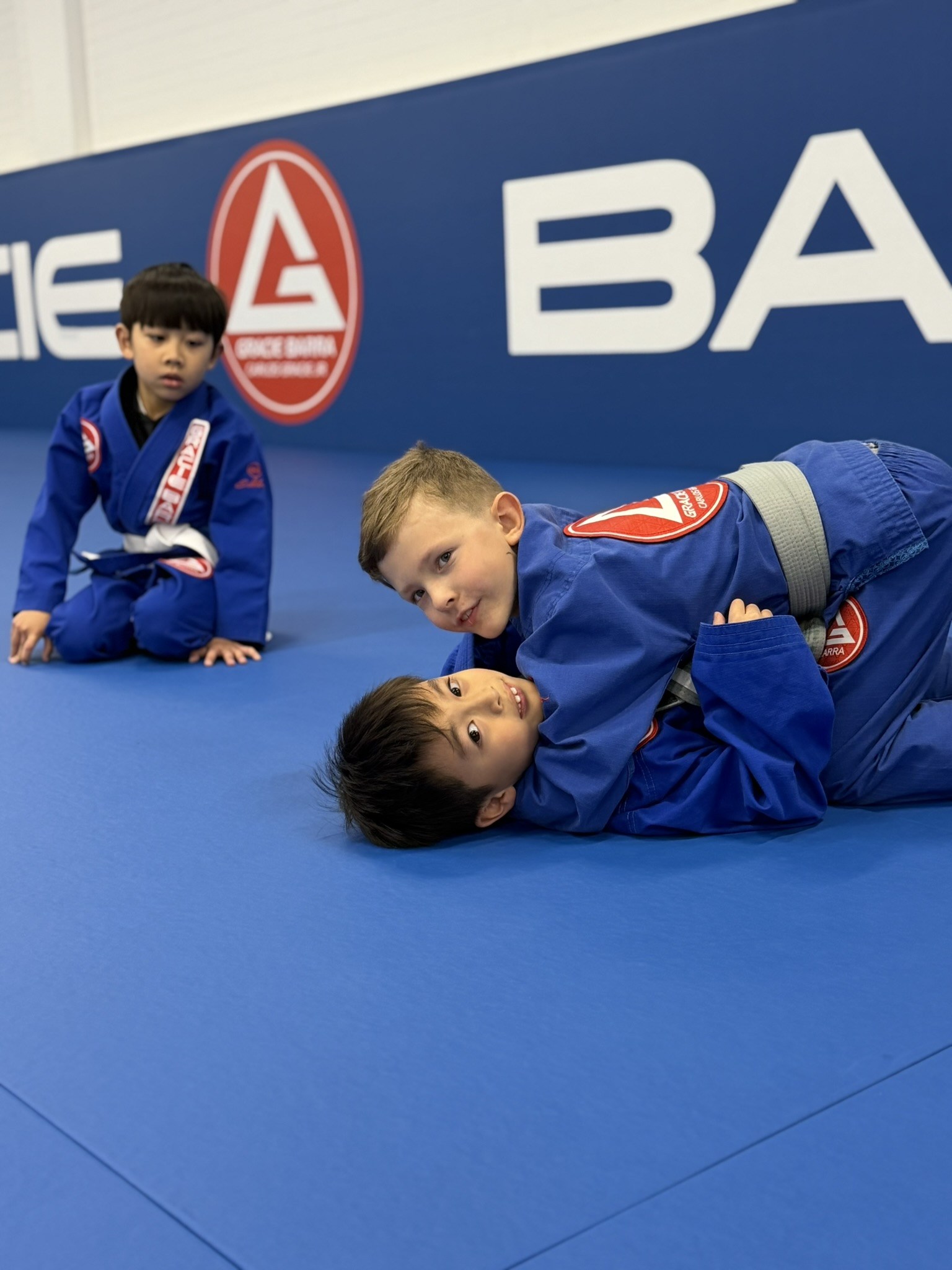 Children enjoying a structured Brazilian Jiu-Jitsu after-school activity at Gracie Barra Artarmon