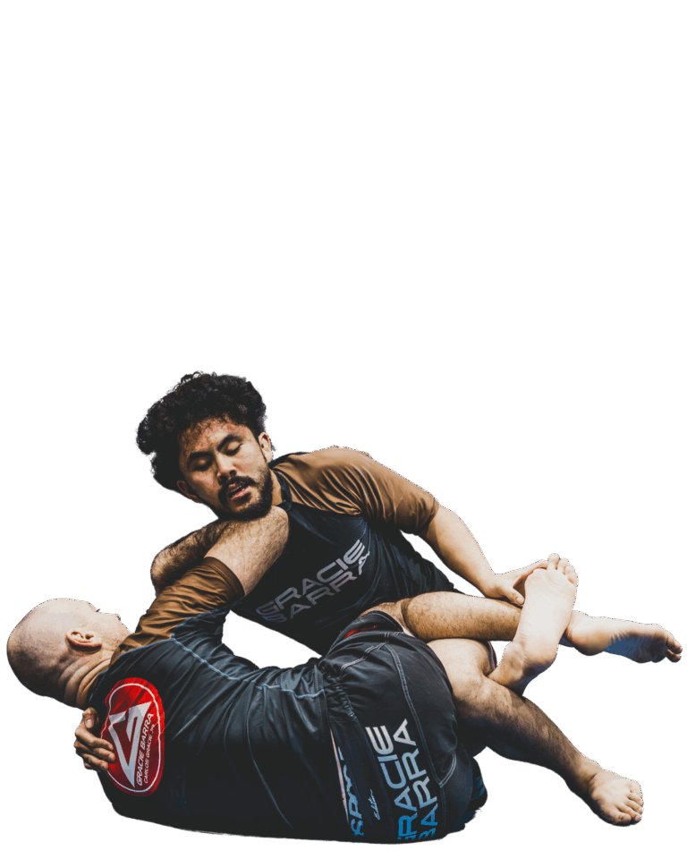 Two men in Gracie Barra gear performing Jiu-Jitsu