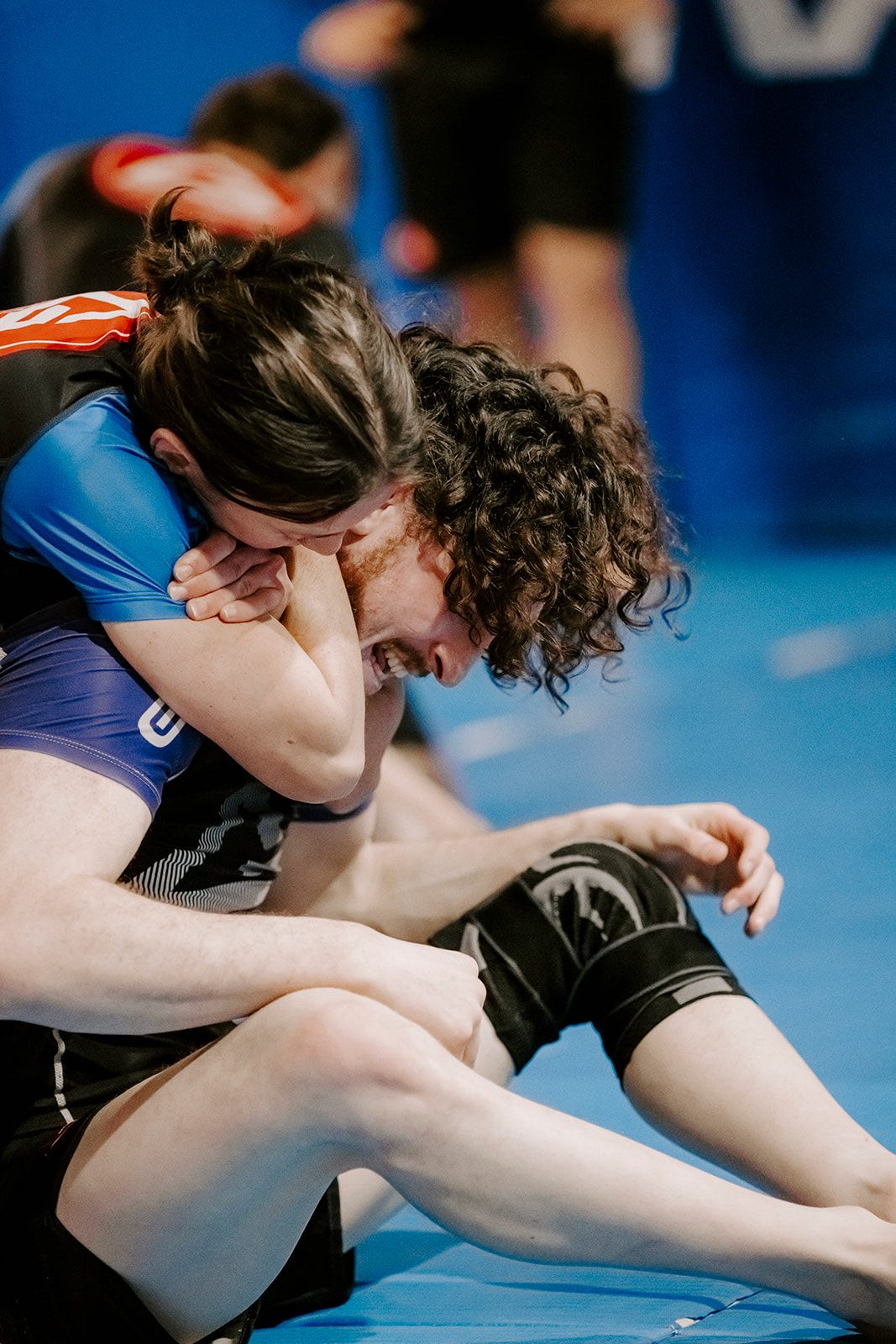 Advanced No-Gi BJJ students practicing back take and choke in Erina