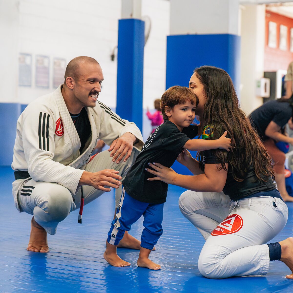 A parent and coach supporting a young Gracie Barra St Peters student
