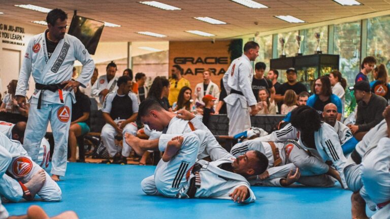 Students participating in a structured Brazilian Jiu-Jitsu fundamentals class at Gracie Barra HQ Sydney in Frenchs Forest.