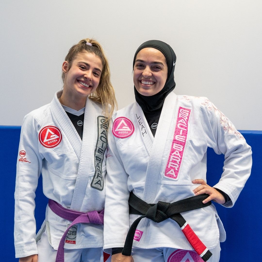 Two female Jiu-Jitsu students training on the mats at Gracie Barra Oceania
