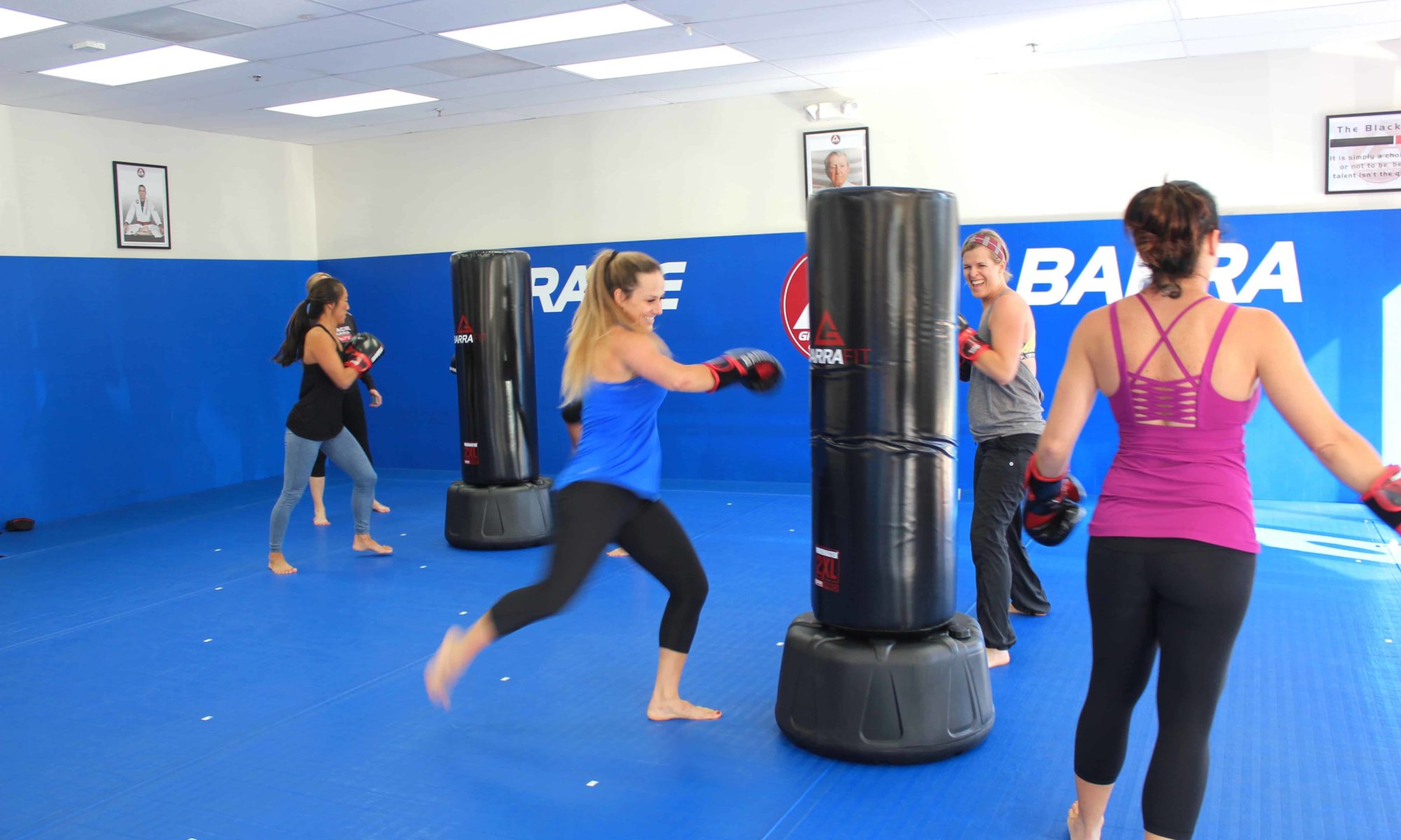 Group of women training Brazilian Jiu-Jitsu in studio