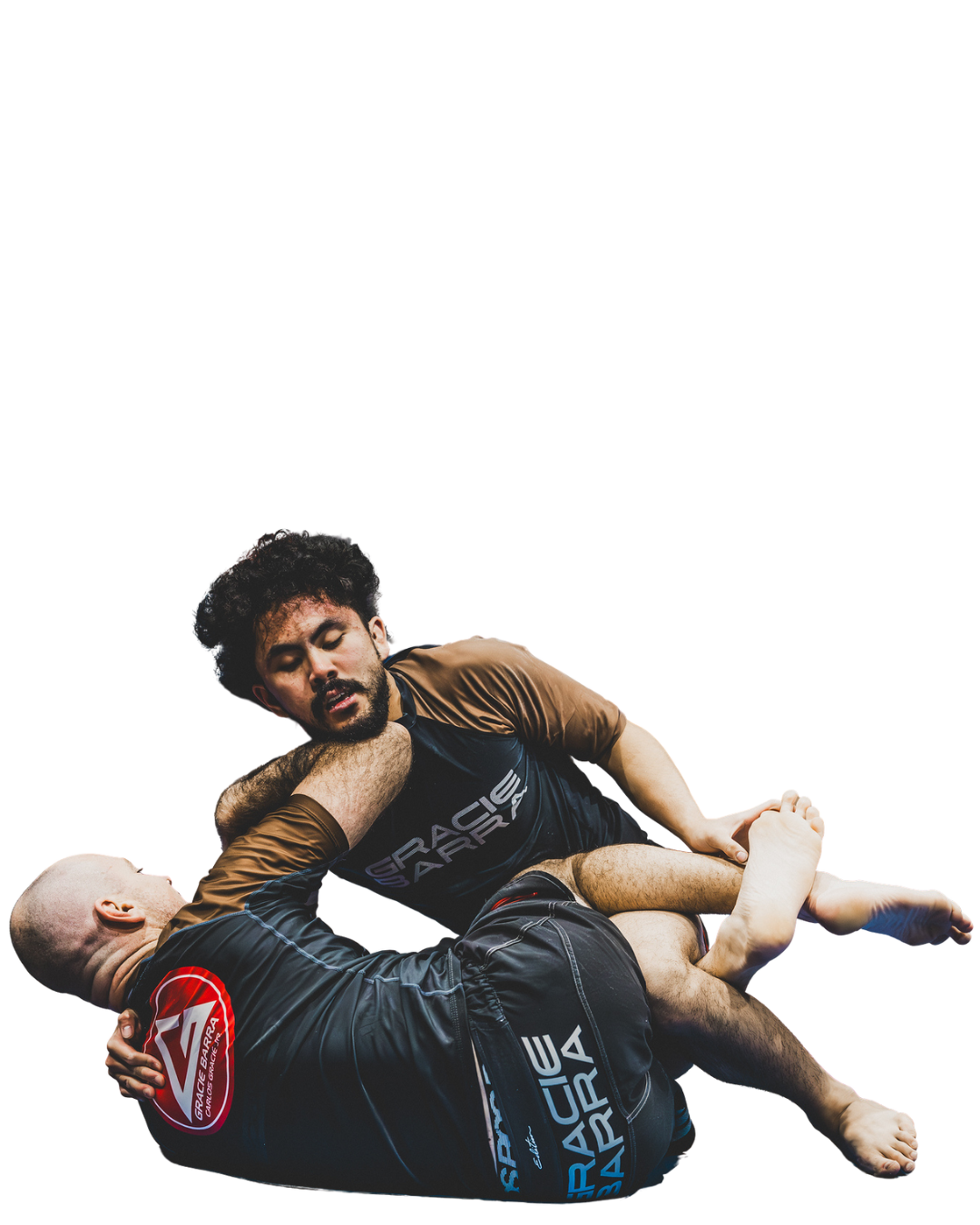 Two men in Gracie Barra gear performing Jiu-Jitsu
