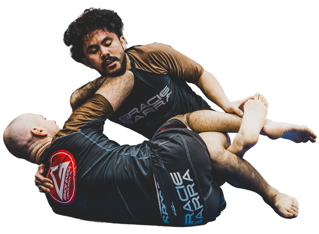 Two men in Gracie Barra gear performing Jiu-Jitsu