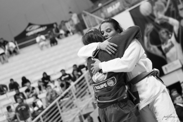 Kelly Nakagawa-Oliveira from Gracie Barra Chino embraces her opponent after a grueling match