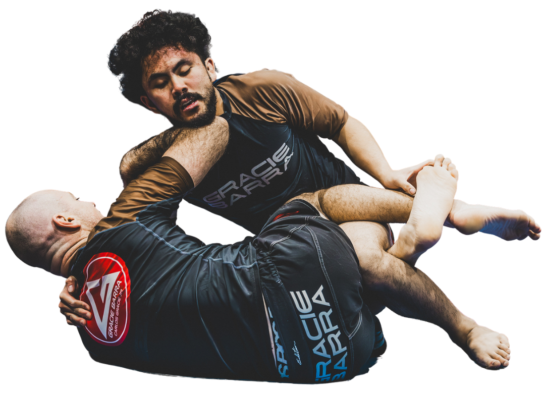 Two men in Gracie Barra gear performing Jiu-Jitsu