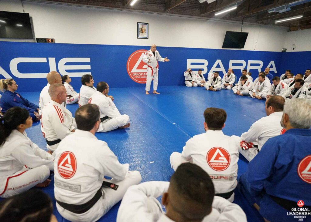 Students at a Gracie Barra school surrounding instructor
