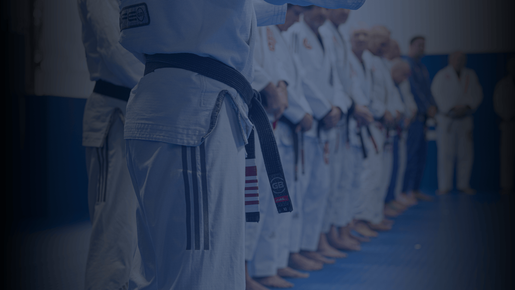 Gracie Barra students in gear standing in a row